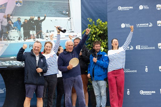 Gilles Fournier and his crew are awarded the trophy for winning IRC One by RORC Commodore James Neville