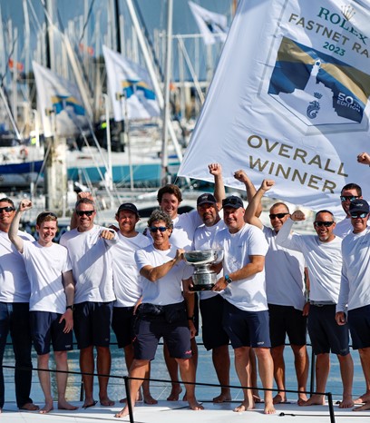 Max Klink (right) and tactician Adrian Stead (left) plus the Caro crew with the Rolex Fastnet Race overall winner's trophy