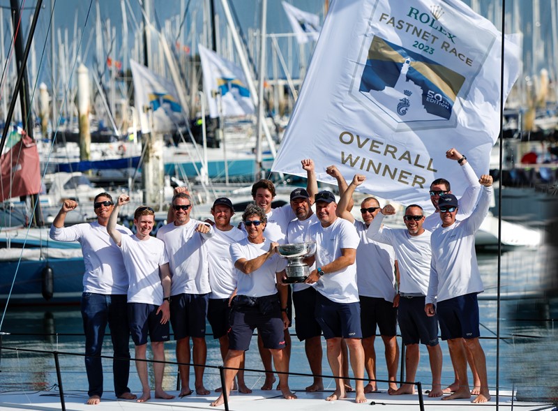 Max Klink (right) and tactician Adrian Stead (left) plus the Caro crew with the Rolex Fastnet Race overall winner's trophy