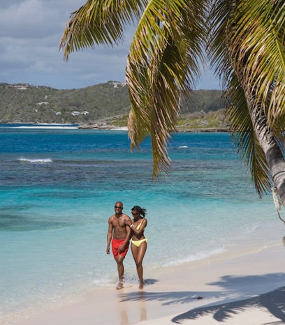 Tourists on Antigua and Barbuda beach