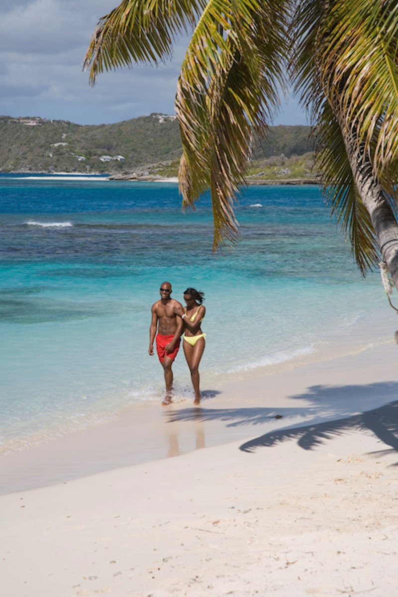 Views of Antigua and Barbuda beach stroll with couple 