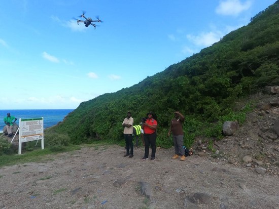 Workshop participants in Montserrat flying a drone