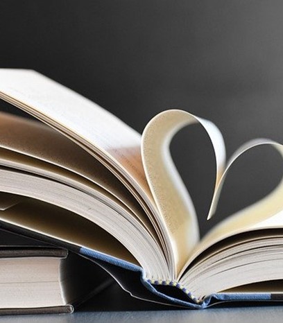 Open book with leaves folded as a heart