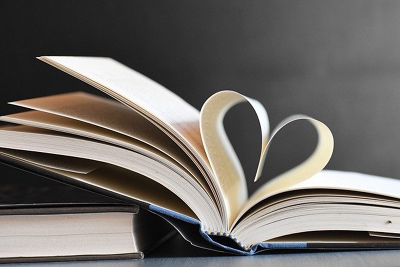 Open book with leaves folded as a heart