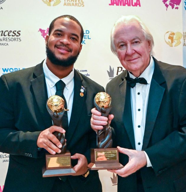 Jameel Rochester, director of tourism at the Anguilla Tourist Board, accepts the 2026 Caribbean’s Leading Culinary Destination and Caribbean’s Leading Luxury Island Destination awards on behalf of Anguilla from World Travel Awards founder Graham Cooke at Princess Grand Jamaica on Oct.