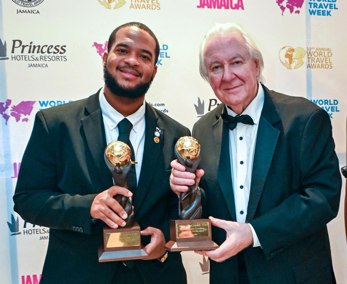 Jameel Rochester, director of tourism at the Anguilla Tourist Board, accepts the 2026 Caribbean’s Leading Culinary Destination and Caribbean’s Leading Luxury Island Destination awards on behalf of Anguilla from World Travel Awards founder Graham Cooke at Princess Grand Jamaica on Oct.