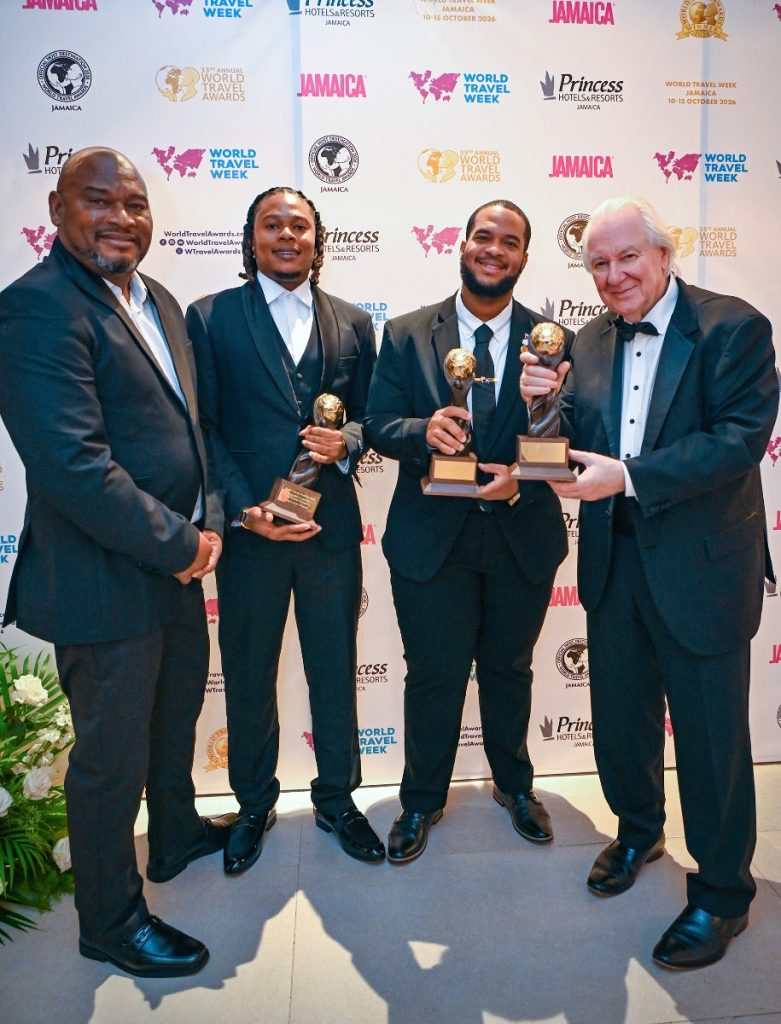 Jameel Rochester, director of tourism at the Anguilla Tourist Board, and Graham Cooke, founder of the World Travel Awards, with Andy and Omar Connor of Andy’s Auto Rentals during the Oct. 11 gala ceremony at Princess Grand Jamaica. Photo by Ashley Anguin