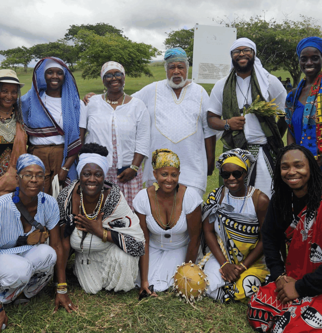 beah Opera cultural practitioners visited the Newton Enslaved Burial Ground to make a special offering. Creator of Obeah Opera Nicole Brooks (sitting second left) said the group’s visit to Barbados was a historical reconnection. (Photos by Sheria Brathwaite)