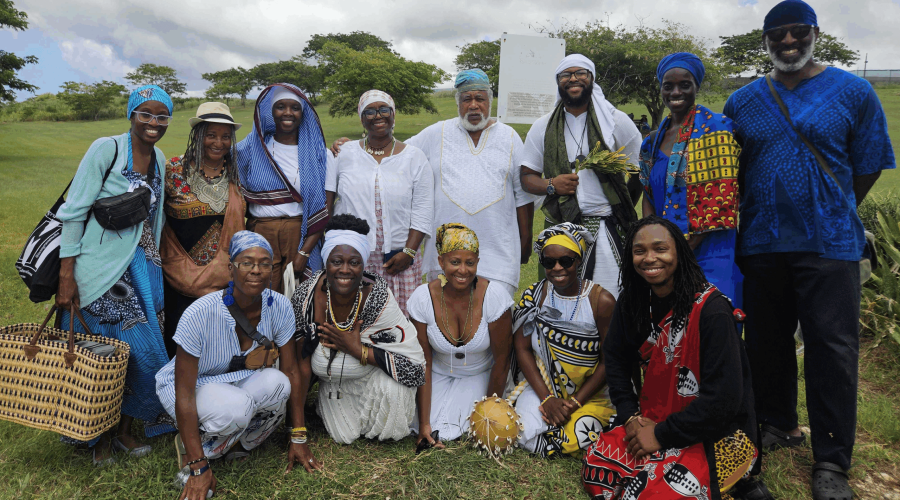 beah Opera cultural practitioners visited the Newton Enslaved Burial Ground to make a special offering. Creator of Obeah Opera Nicole Brooks (sitting second left) said the group’s visit to Barbados was a historical reconnection. (Photos by Sheria Brathwaite)