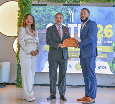 Dr. Dalano DaSouza accepts the tourism intelligence award from CTO Chairman Charles Fernandez, minister of tourism, Antigua and Barbuda, while CTO Secretary-General Dona Regis-Prosper looks on.