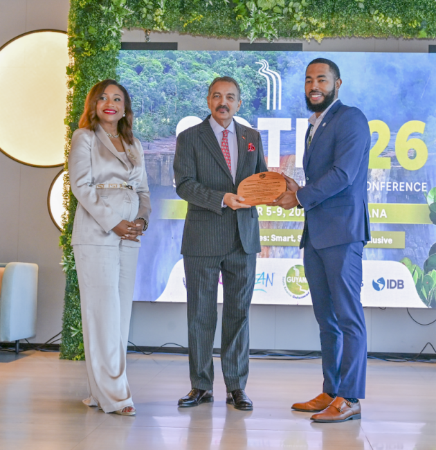 Dr. Dalano DaSouza accepts the tourism intelligence award from CTO Chairman Charles Fernandez, minister of tourism, Antigua and Barbuda, while CTO Secretary-General Dona Regis-Prosper looks on.